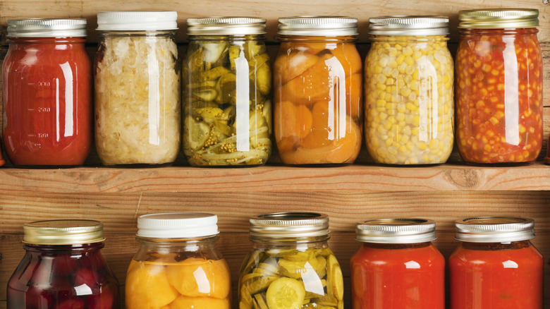 canned vegetables in jars on shelf
