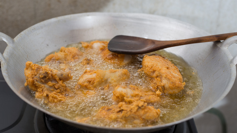 Fried chicken and wooden spoon