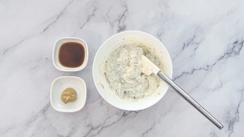 small bowls of tartar sauce ingredients