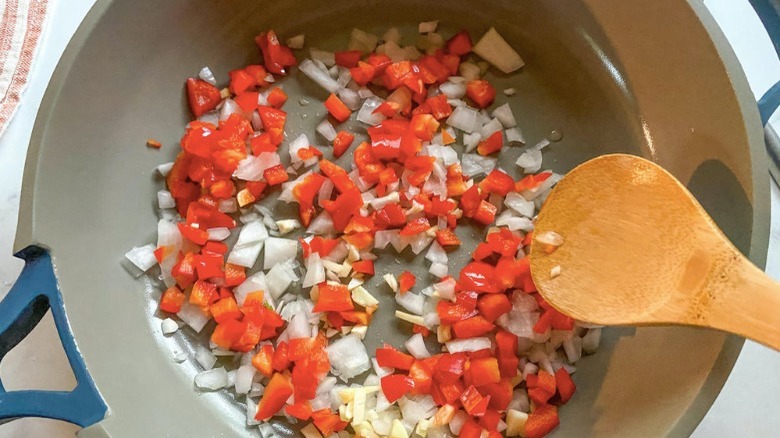vegetables cooking in oil pan