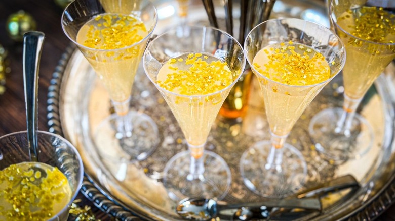 New Year's Eve champagne jell-o shots with gold stars close-up