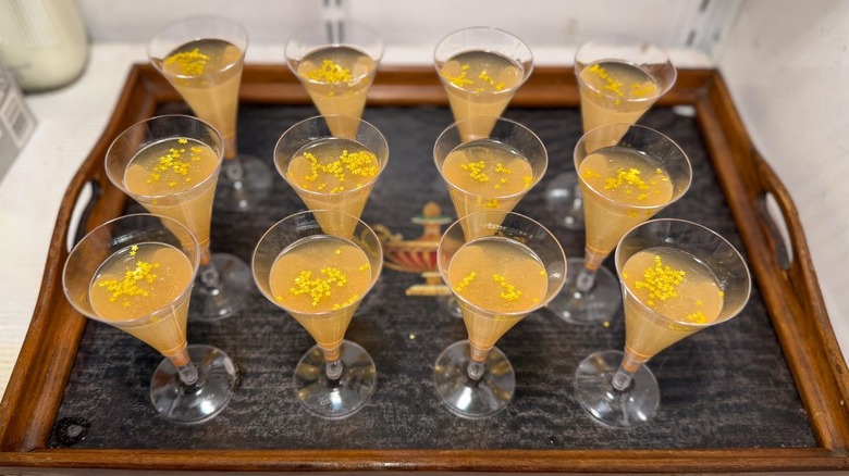 Champagne jell-o shots on tray in refrigerator