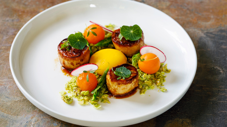 scallop dish with a confit egg yolk