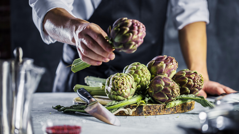Chef with artichokes