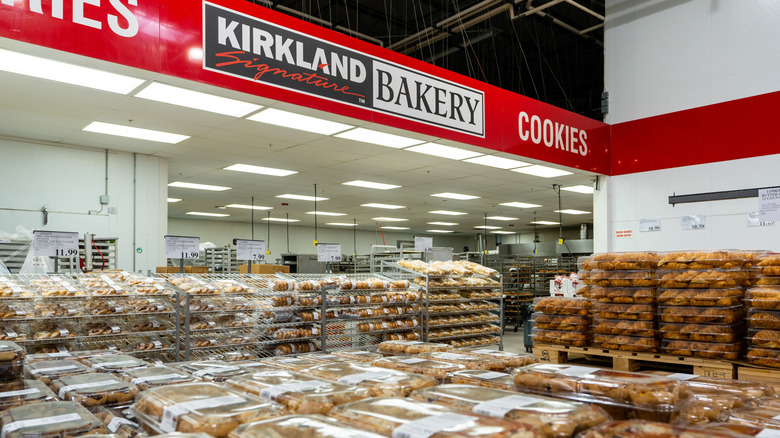 bakery department at costco featuring stacks of packages of baked goods