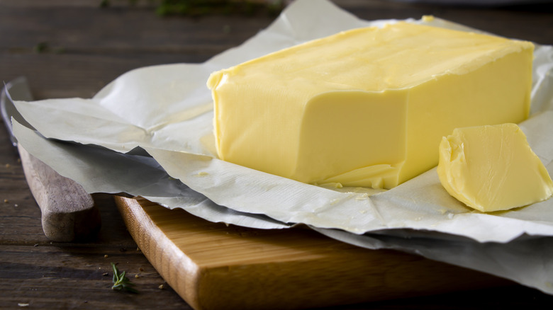 block of butter on a chopping board