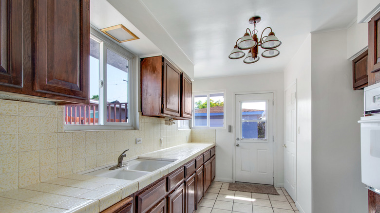 Old kitchen with outdated wooden cabinets