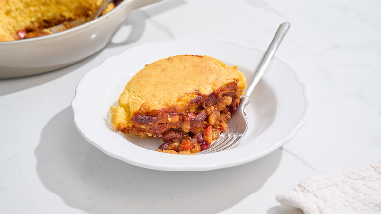 slice of beanie weenie casserole on a plate