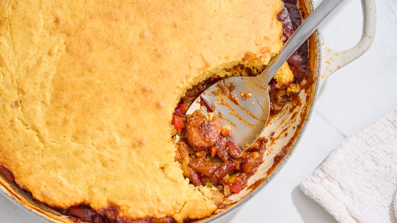 beanie weenie casserole with a slice taken out of it