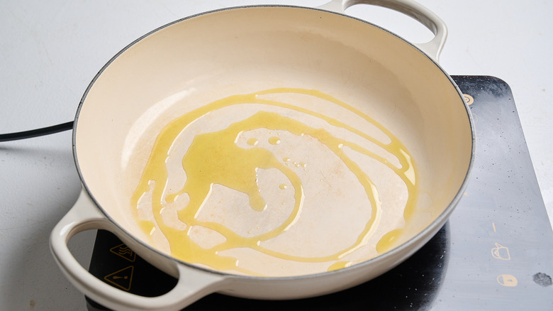 heating oil in a skillet