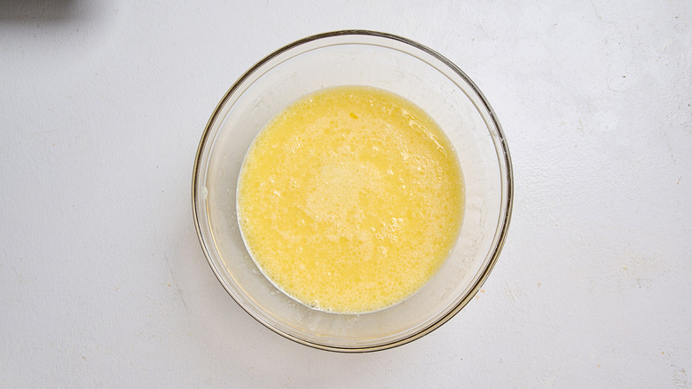 eggs and milk whisked together in a bowl