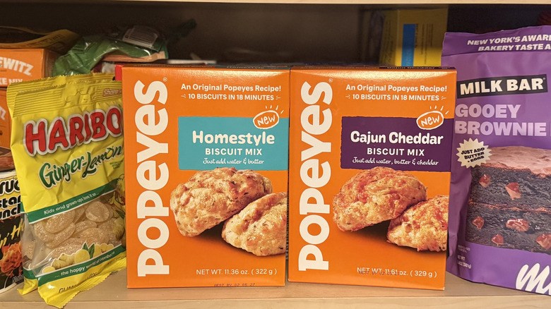 Popeyes Biscuit mixes next to other grocery items on a shelf