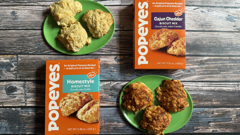 Two boxes of Popeyes Biscuit Mixes and their final baked results on green plates