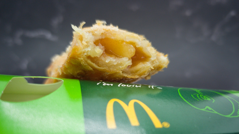 A partially eaten McDonald's apple pie