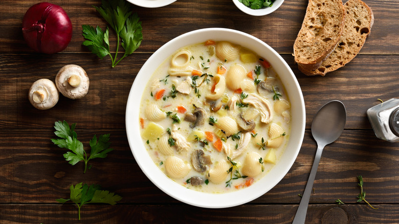 Chicken noodles soup with mushrooms