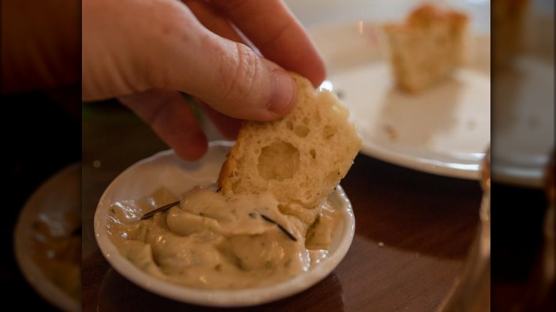 Dipping bread into anchoide