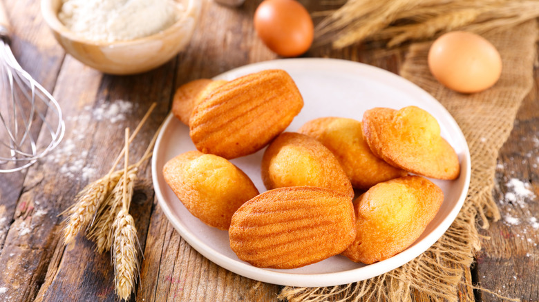 Plate of madeleines with eggs and whisk