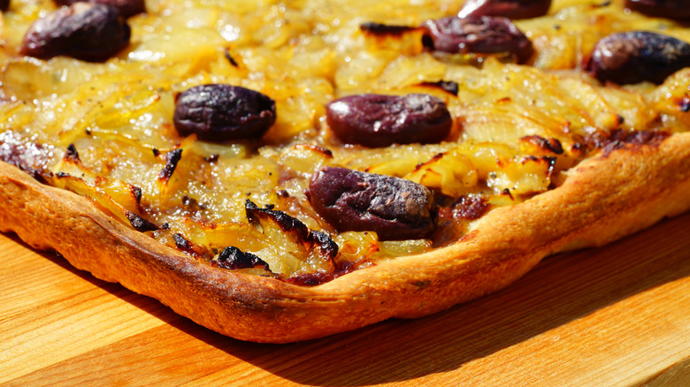 Corner of pissaladiere with olives