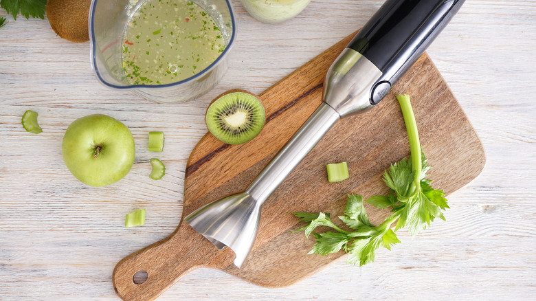 immersion blender on board with fruit