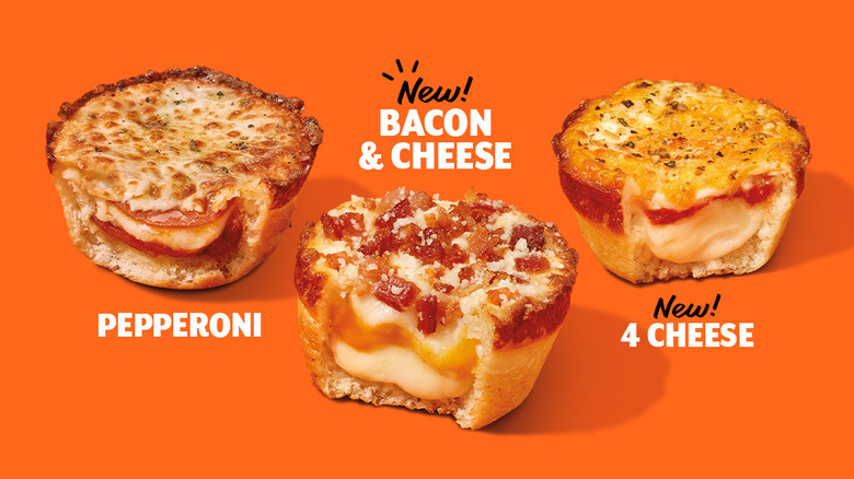 Trio of Little Caesars Crazy Puffs: pepperoni, bacon & cheese, and 4 cheese. Each is cut open to show the inside