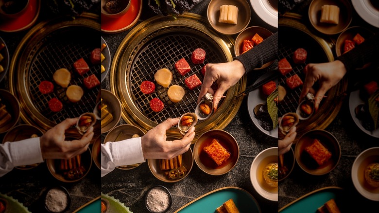 Two people toasting with Korean bbq