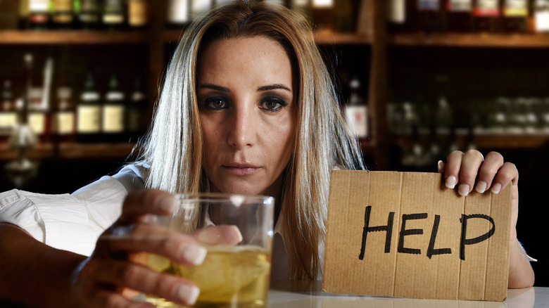 Woman at bar asking for help
