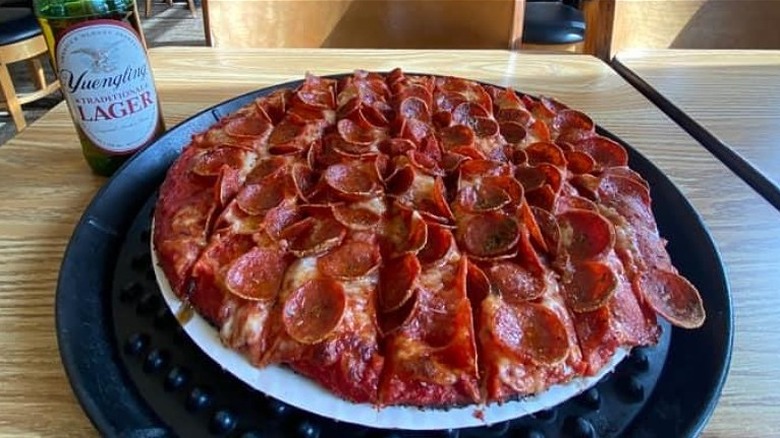 Columbus Style pizza with beer