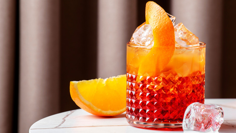 A Negroni Sbagliato garnished with an orange peel