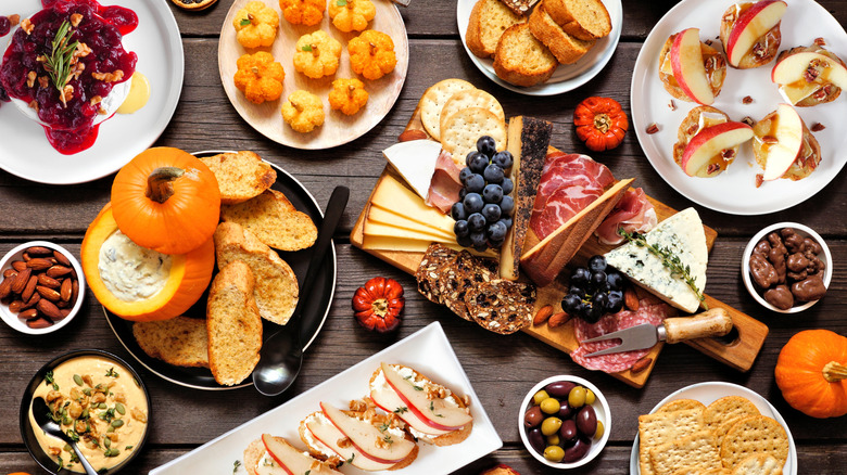 Overview of table with fall-themed snacks and treats