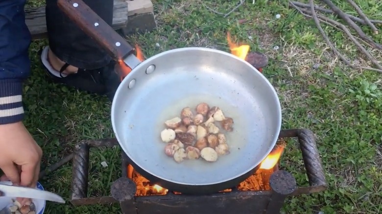 Frying pan with false truffles cooking in them