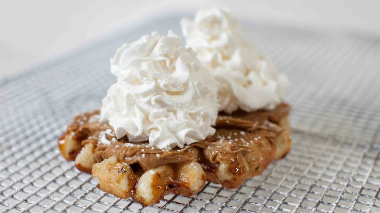 Waffle topped with whipped cream