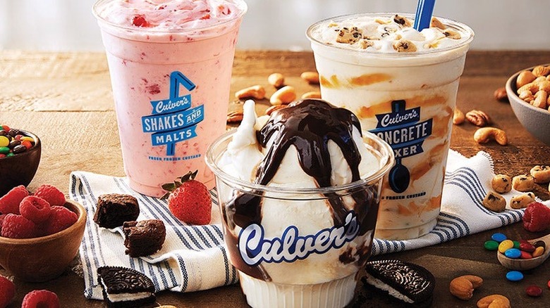 an array of Culver's frozen custard mixers, with vanille and fudge, vanilla and caramel, and strawberry adorned with assorted toppings.