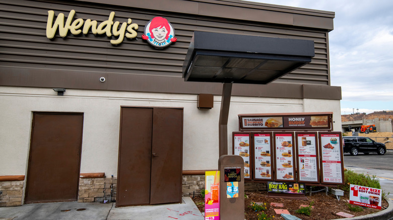 Wendy's store exterior, with its drive thru order speaker and menu on display