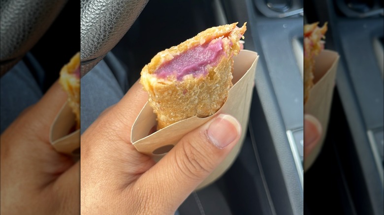 A hand holds a Jollibee Ube Pie