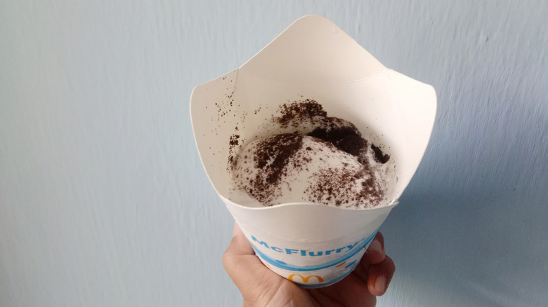 A hand holds an Oreo McFlurry