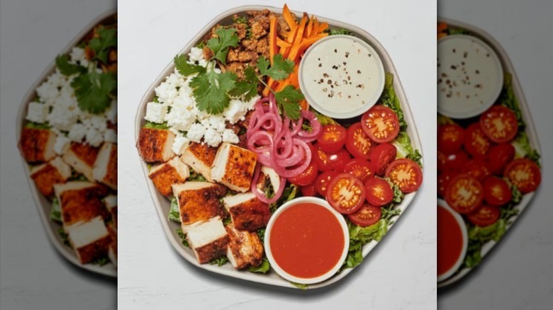 Buffalo chicken salad on white background