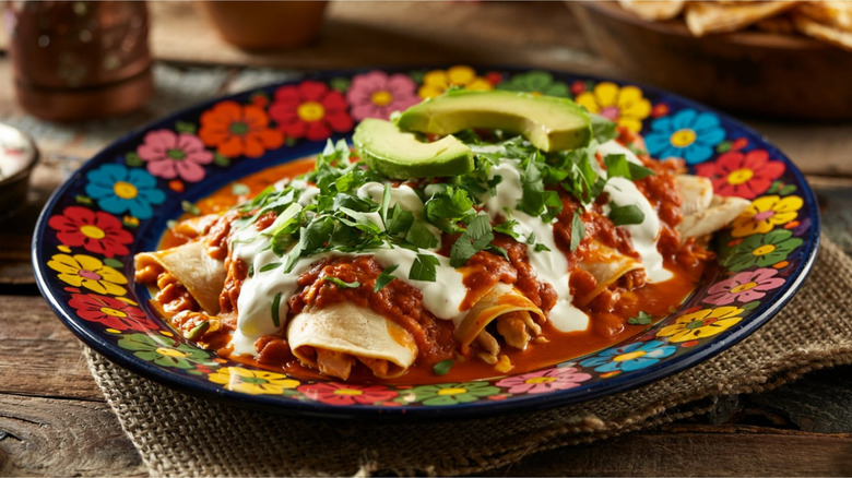 Enchiladas served on a blue flower-patterned bowl
