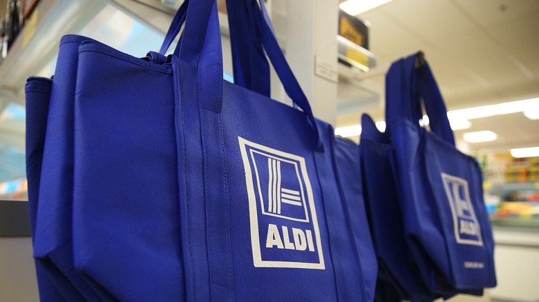Aldi bags hanging on a hook