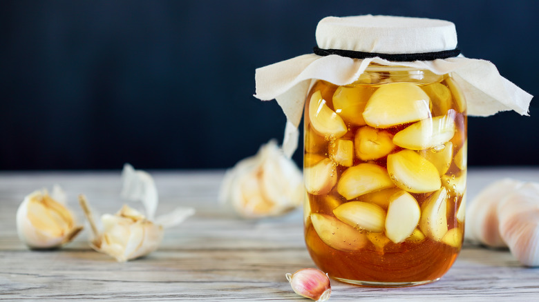 Glass jar of fermented garlic honey