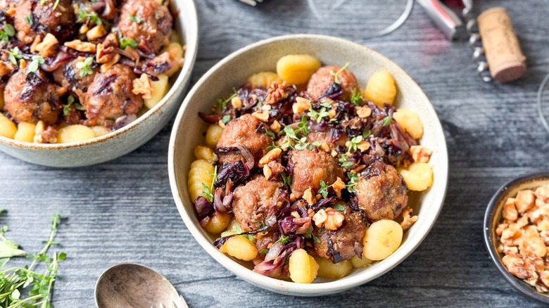 Fig and gorgonzola meatballs with radicchio and crispy gnocchi in serving bowls
