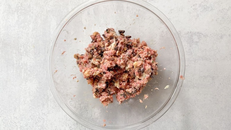 Fig and gorgonzola meatball mixture in large glass bowl