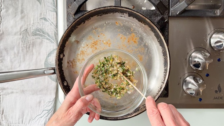 Transferring sautéed aromatics from skillet to glass bowl to cool