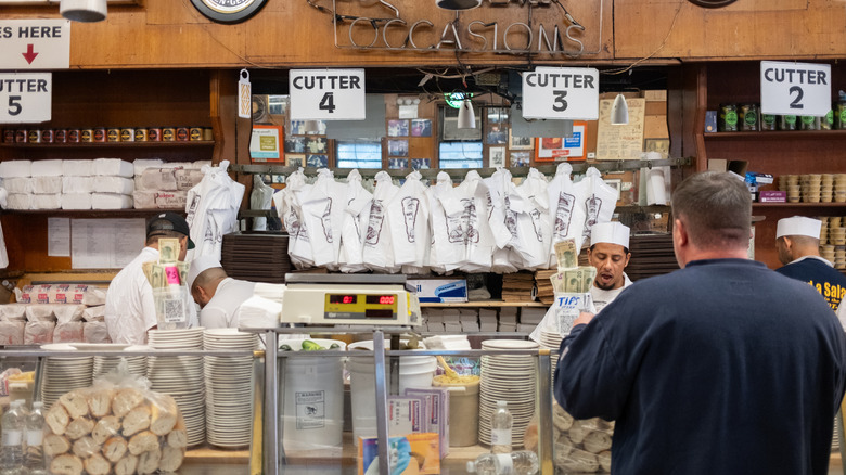 A customer orders from the deli counter at Katz's Delicatessen in NYC