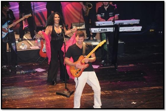 Firehouse Subs co-founder Chris Sorensen (center) playing with Earth Wind & Fire