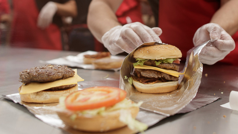 Five Guys worker wrapping burger