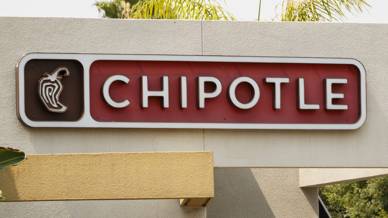 The Chipotle sign is displayed outside a restaurant