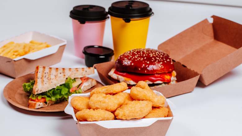 Various fast food dishes against a white background