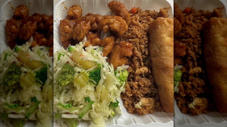 A portion of orange chicken from Manchu Wok, served with a salad, fried rice, and an egg roll