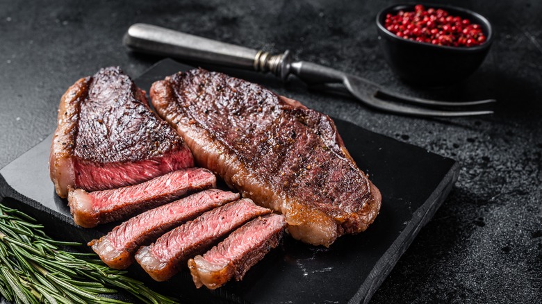 sliced steak on board