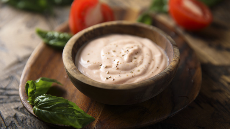 Tomato ranch dressing in a wooden bowl